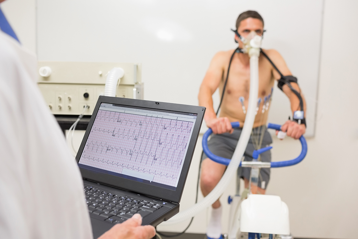 man doing fitness test on exercise bike at the medical centre
